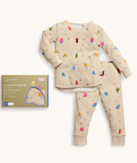 Product shot with the packaging of ergoPouch Long Sleeve Pajamas 0.2 TOG in Birthday Blobs 